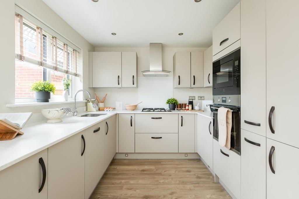 Modern kitchen with ample storage and worktop...