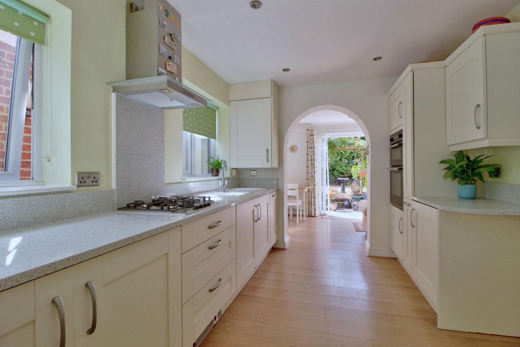 Shaker kitchen leads to sunny breakfast room