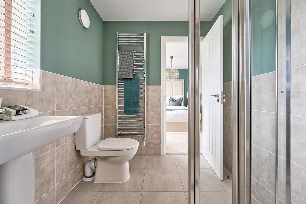 Two of the bedrooms boast en suite shower rooms