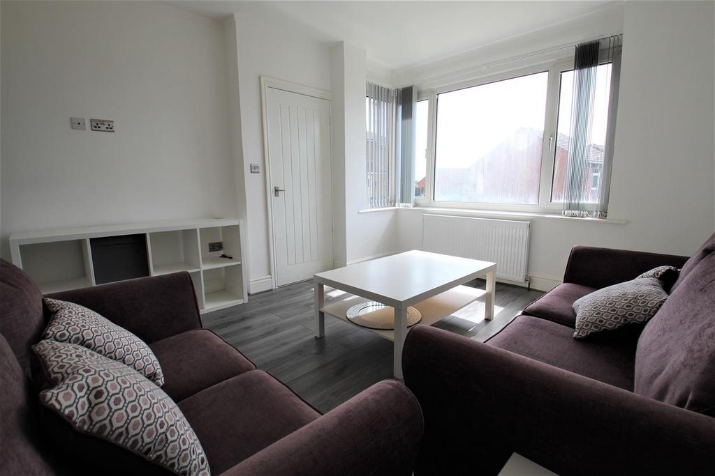 Bright and inviting living room featuring two c...