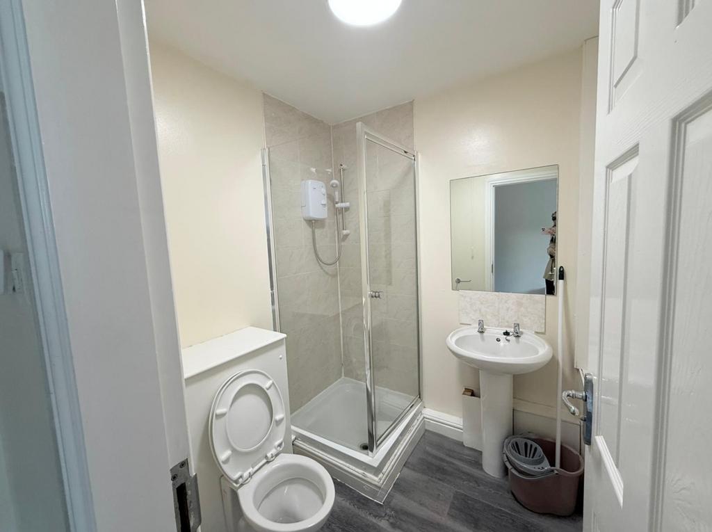 A clean and functional bathroom featuring a cor...