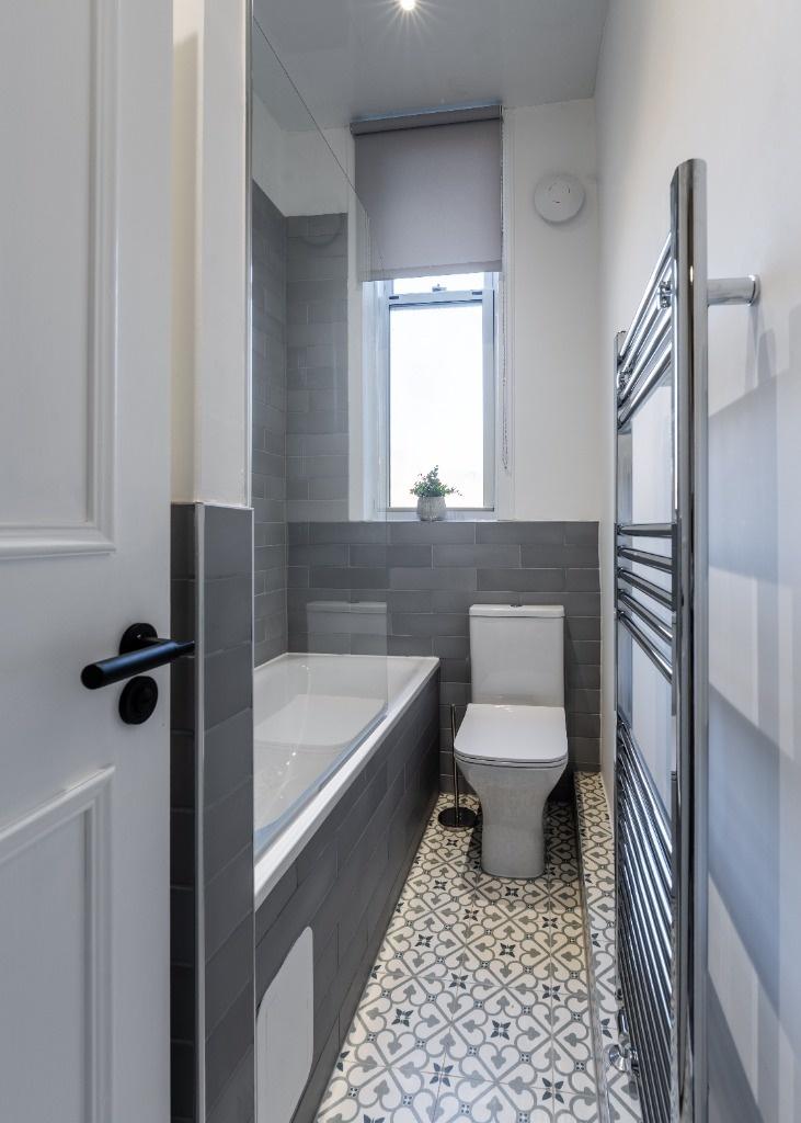 A modern, well-maintained bathroom with a sleek...