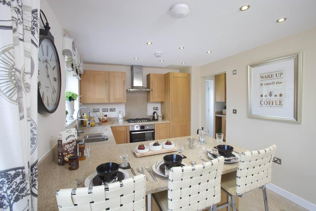 The kitchen features a breakfast bar, perfect...