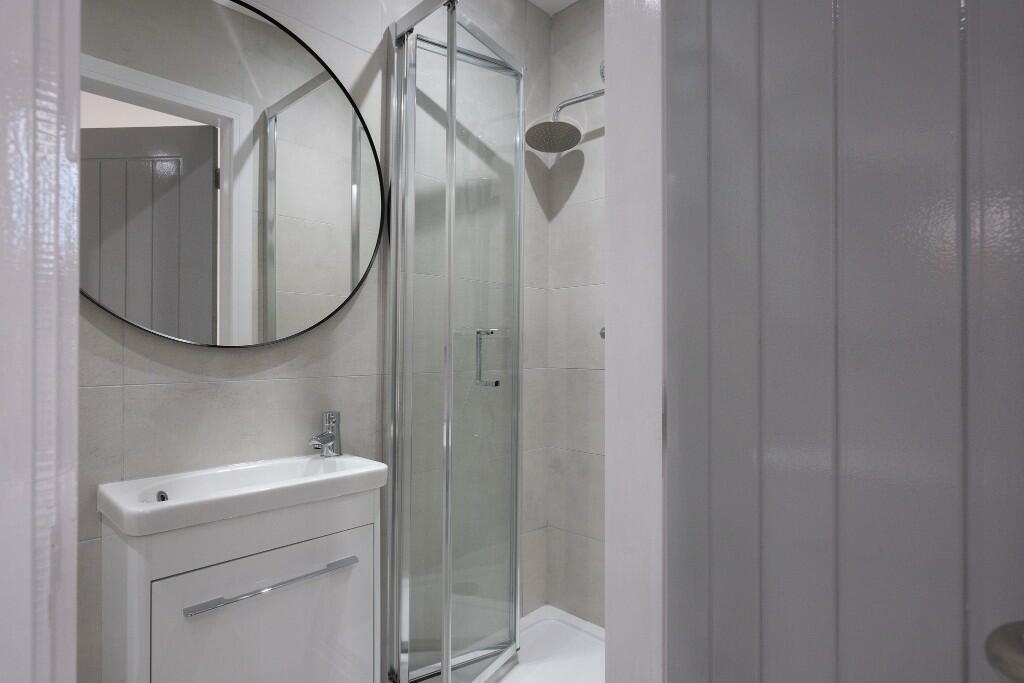 A clean and well-maintained bathroom featuring ...