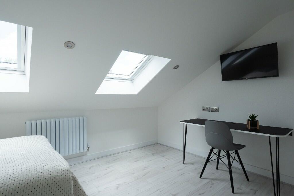 A bright and modern living room with ample natu...