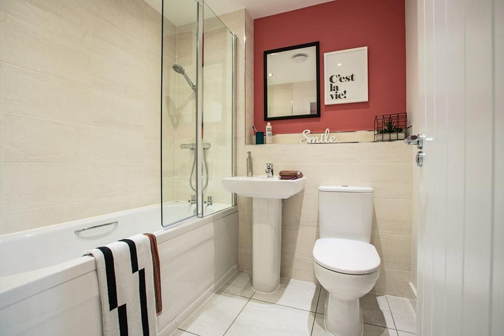 Family bathroom complete with shower over the bath