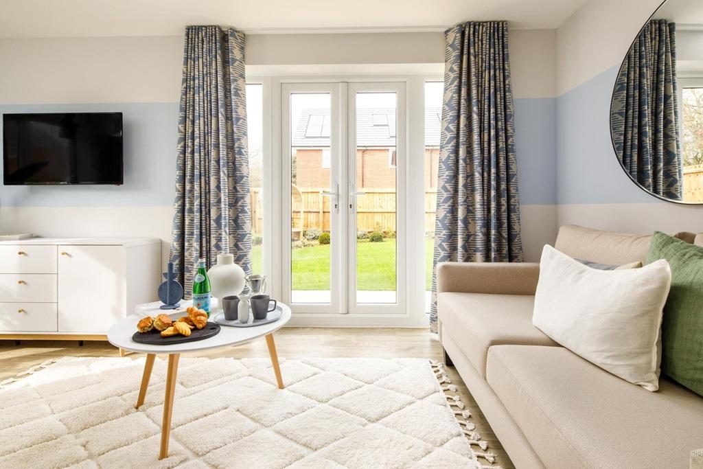 The lounge benefits from French door leading to...