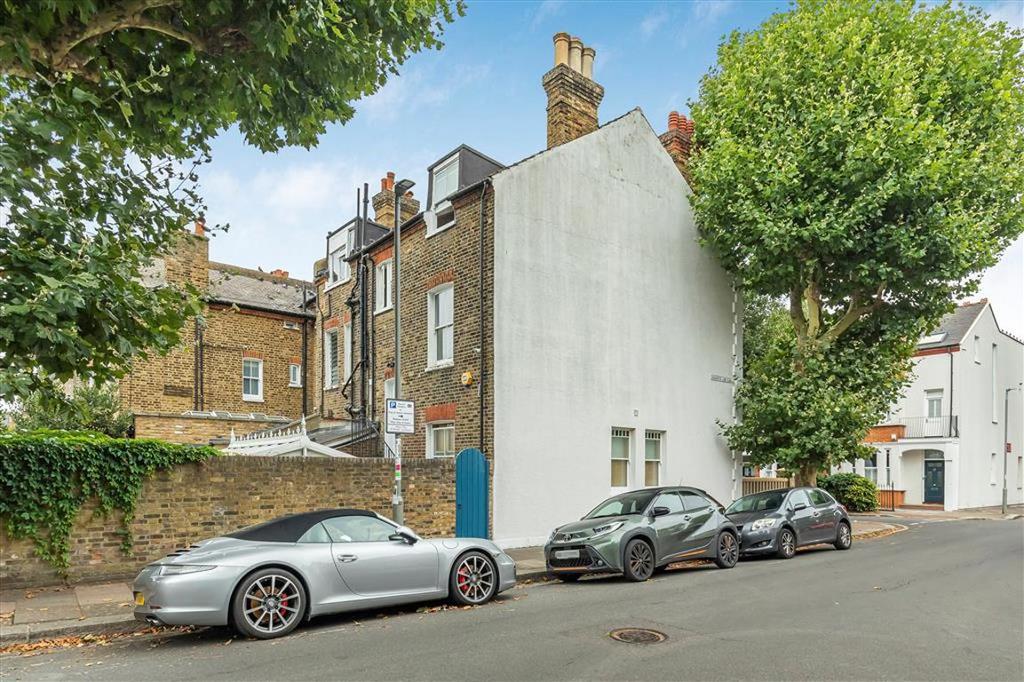 Street scene with property, parking