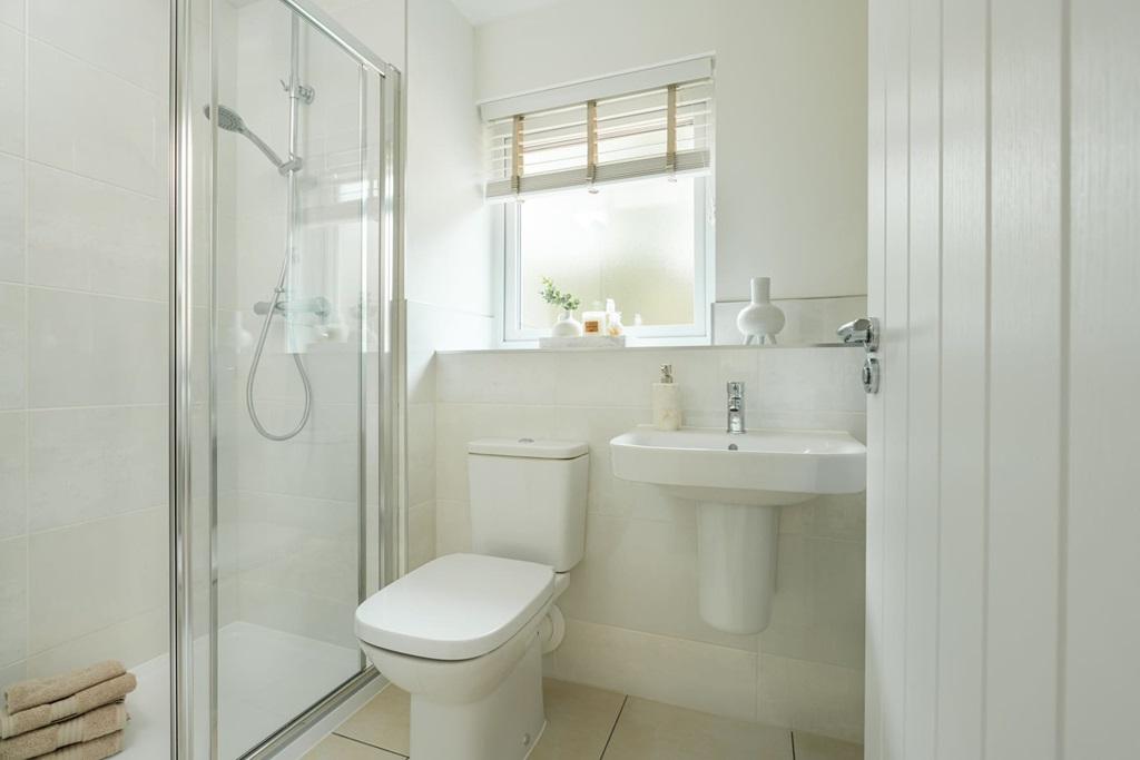The main bedroom has its own en-suite shower room