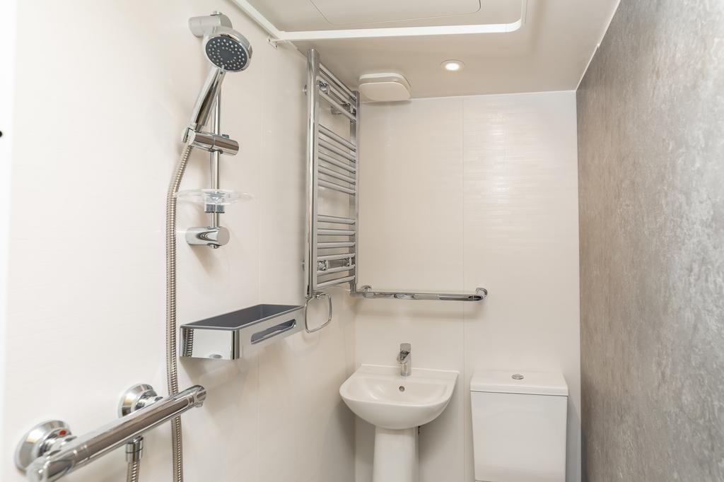 A modern and clean bathroom featuring contempor...