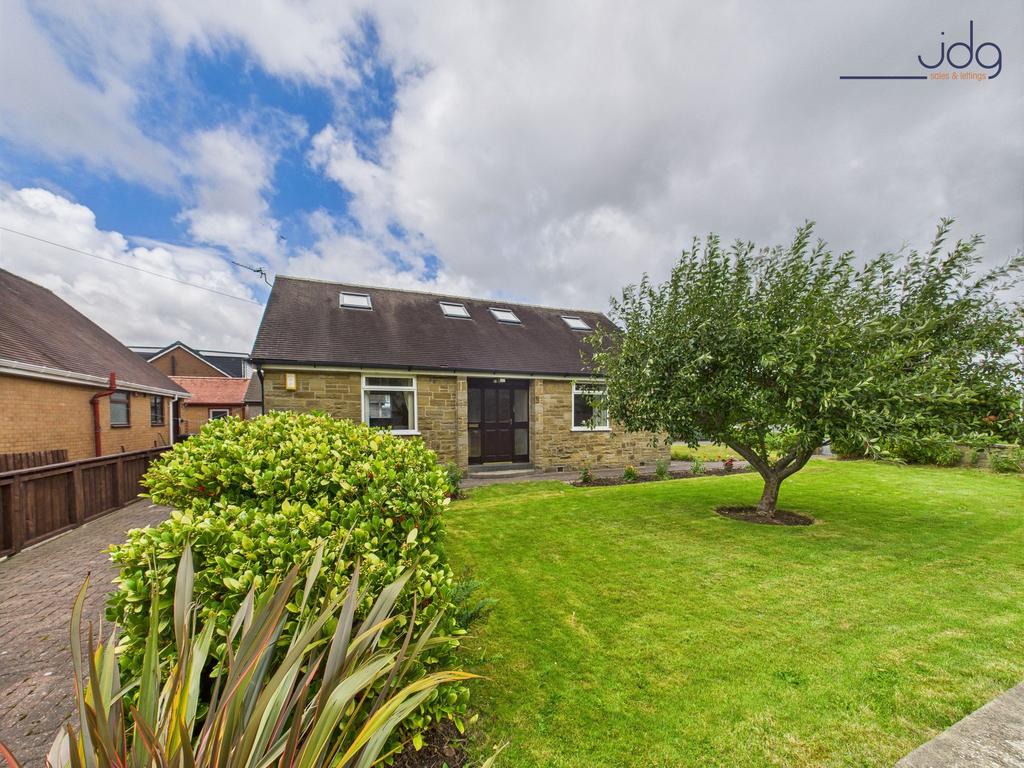 Front of the property with established apple...
