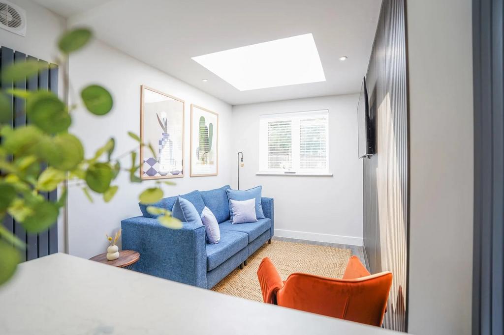 Bright and welcoming living room featuring a co...