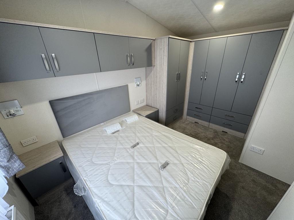 Bed 1 to wardrobe