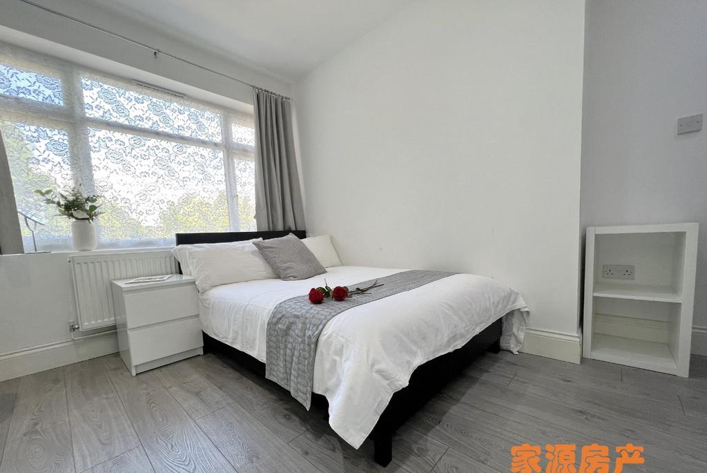 Bright and inviting double bedroom featuring a ...