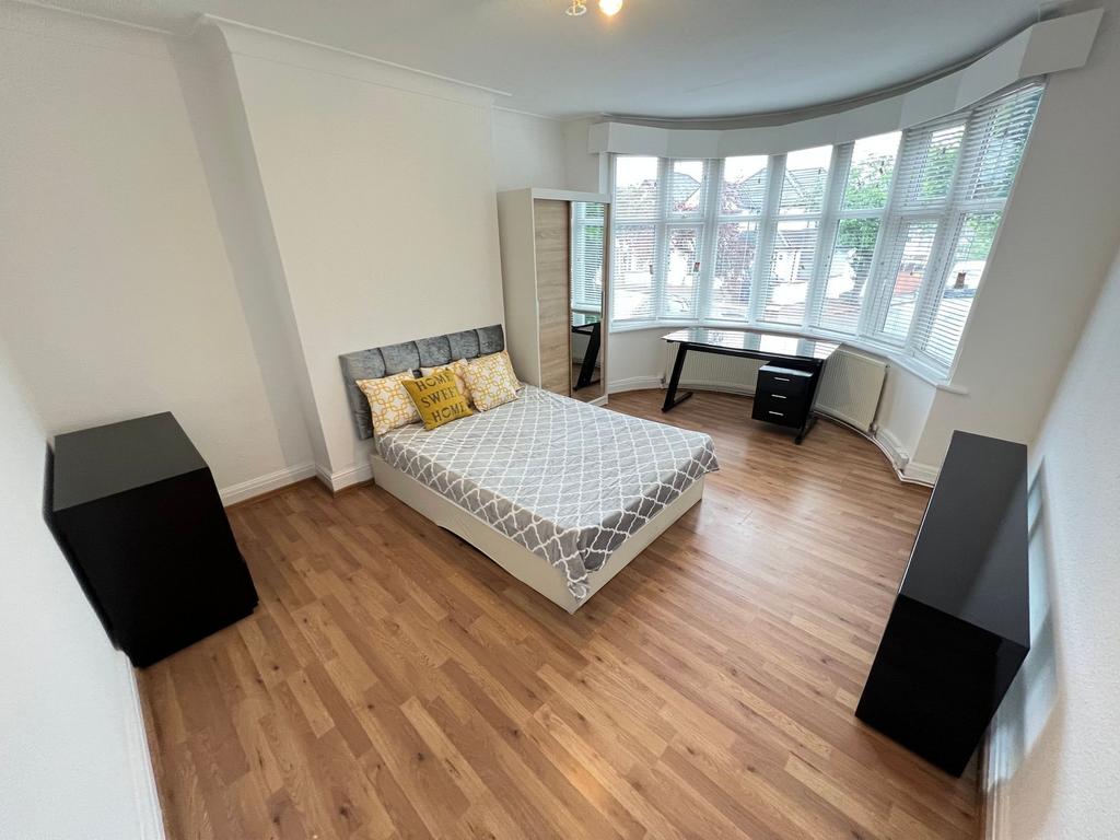 Bright and spacious master bedroom featuring a ...