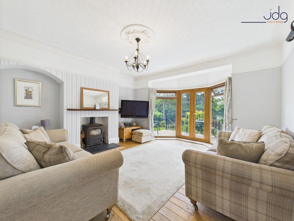 Cosy Lounge with River Views and Log Burner