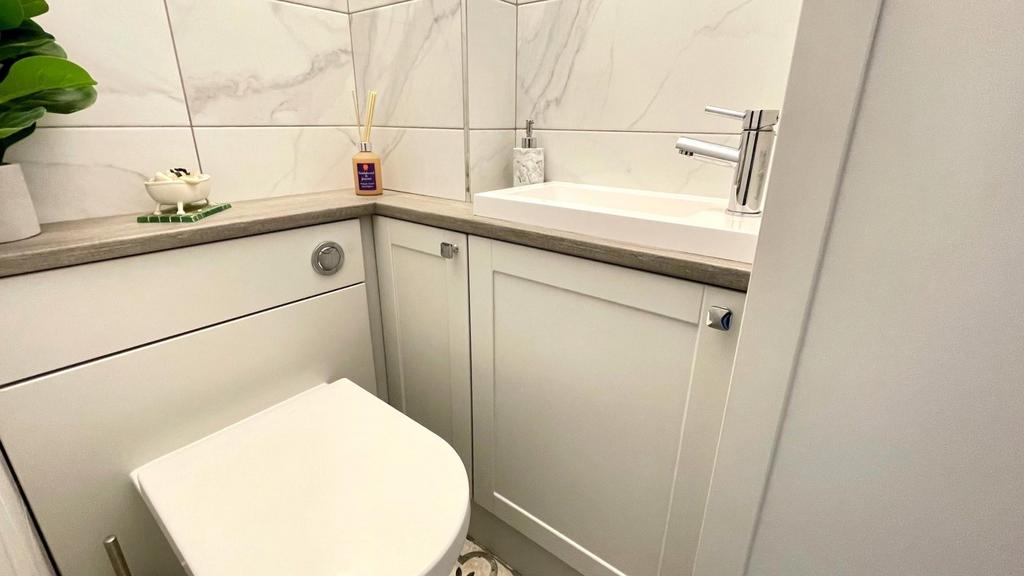 Tiled 2 piece cloakroom