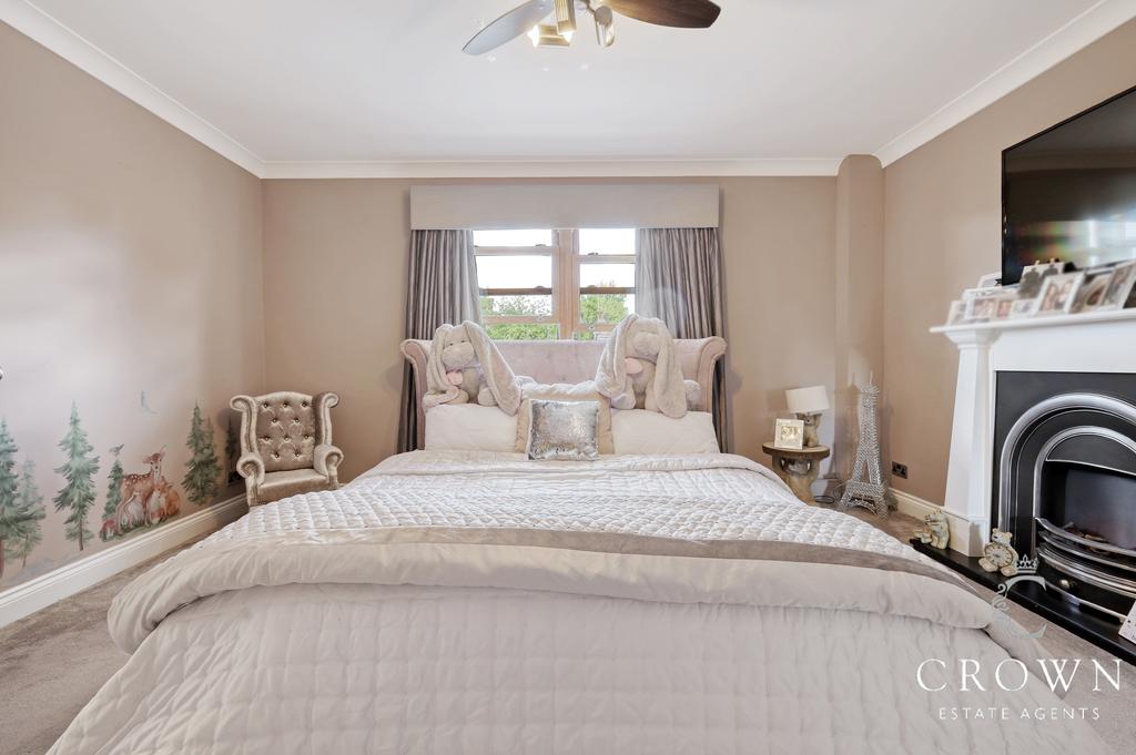 Bedroom Three with Feature Fireplace and fitted wa