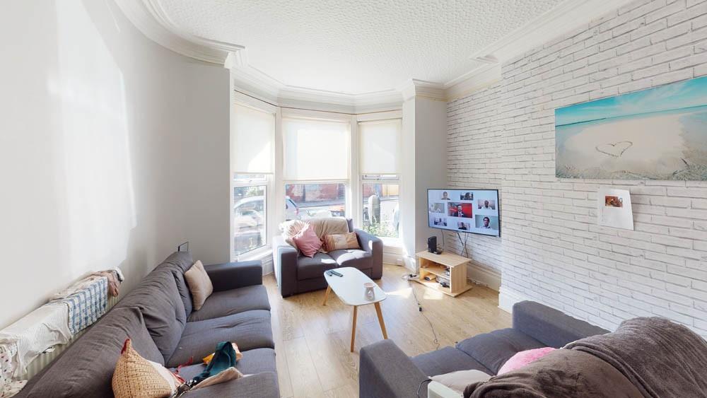 Bright and welcoming living room featuring a sp...