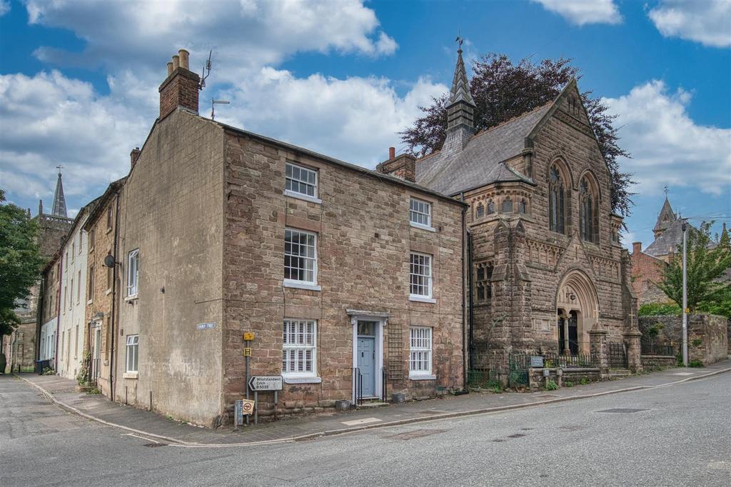 Front of the home and road towards churchyard.jpg