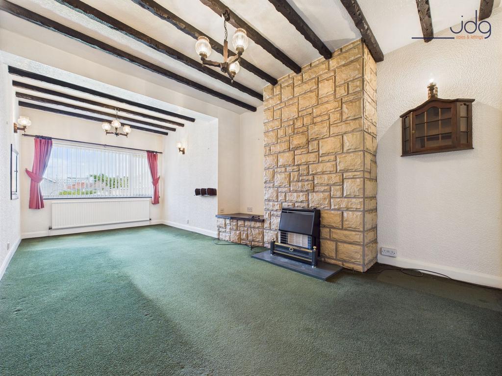 Second sitting room with a stone-clad chimney...