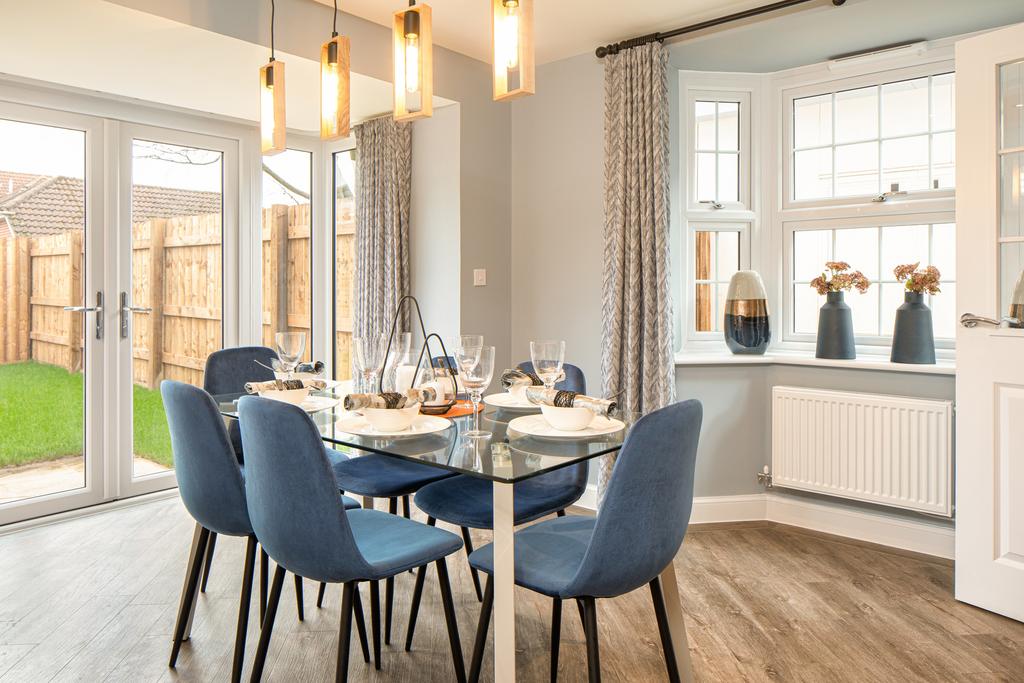 Dining area with bay window, French doors and...