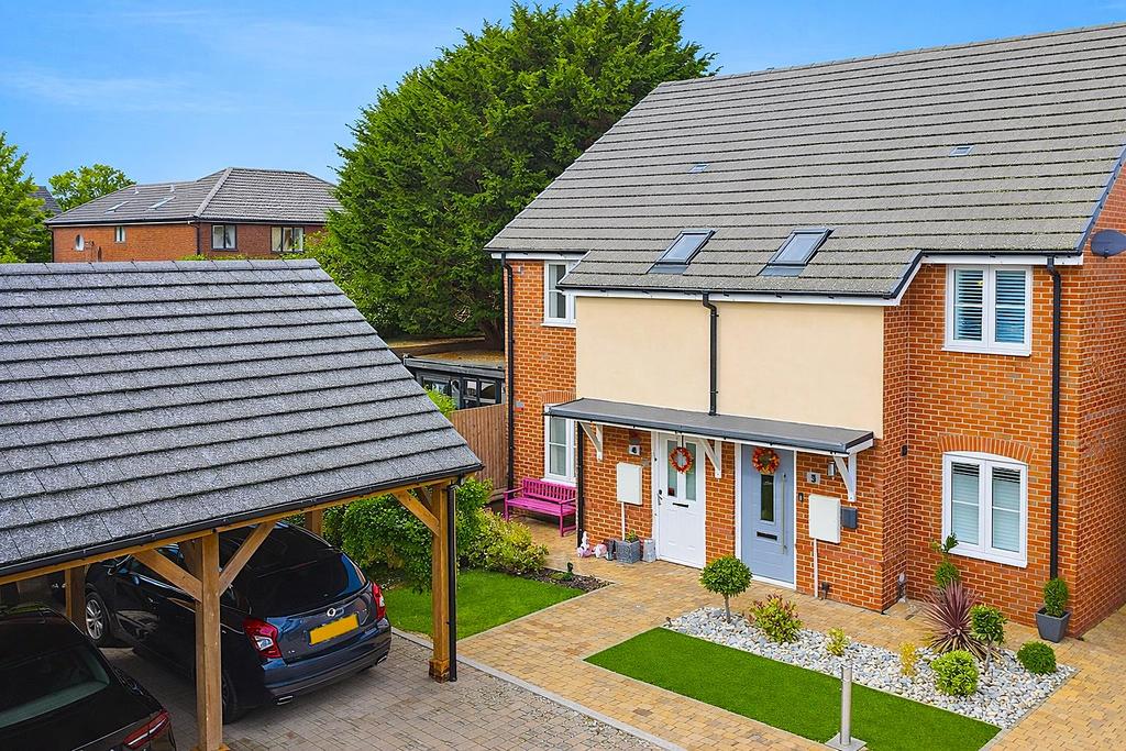 Semi-detached homes with carport and garden.png
