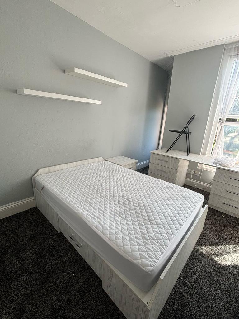 Bright and inviting double bedroom featuring a ...