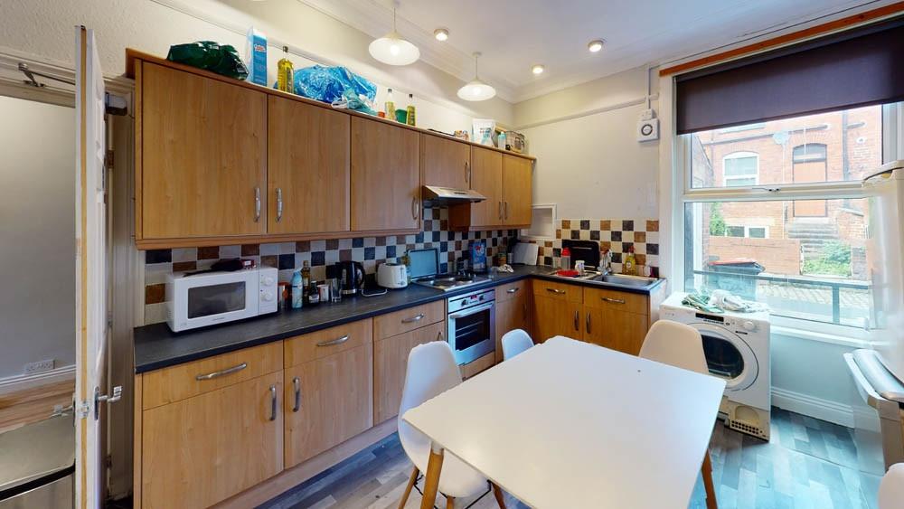 Bright and well-equipped kitchen featuring wood...