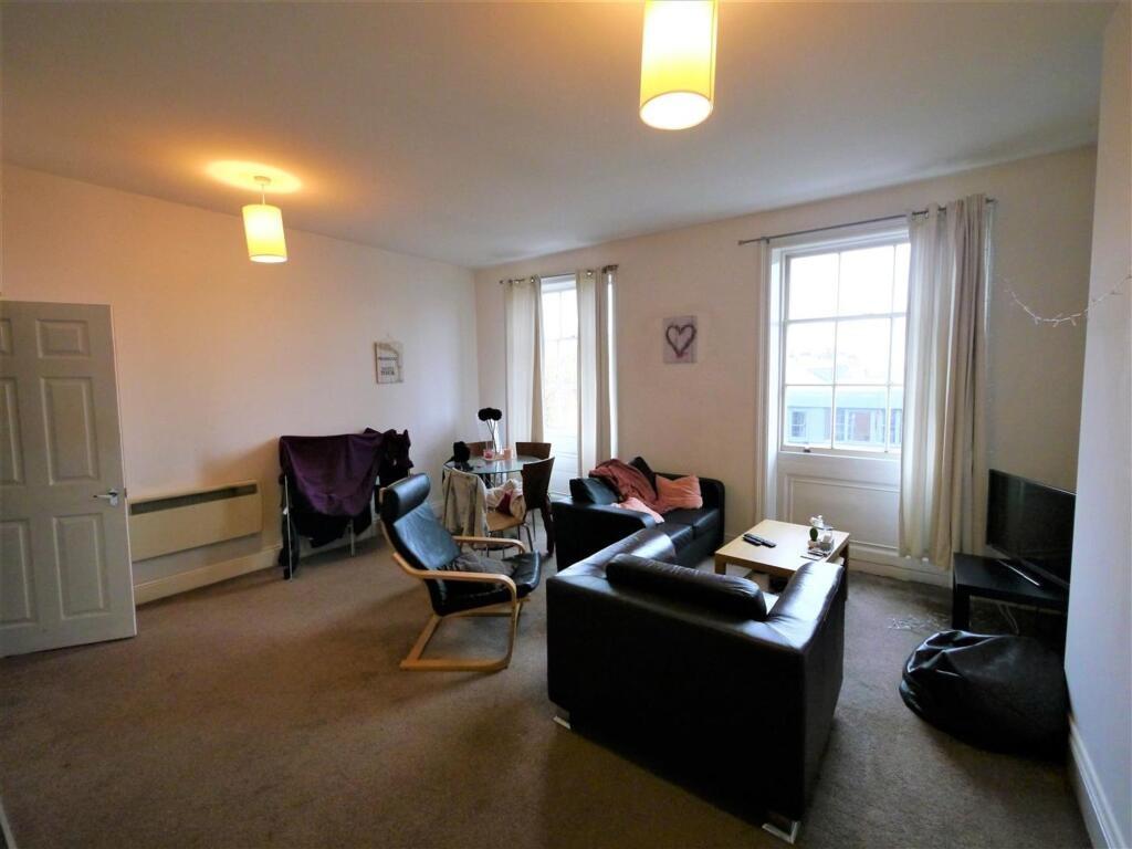 Bright and spacious living room with comfortabl...
