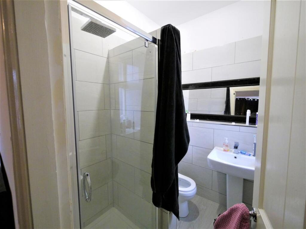 A clean and well-maintained bathroom with a lar...