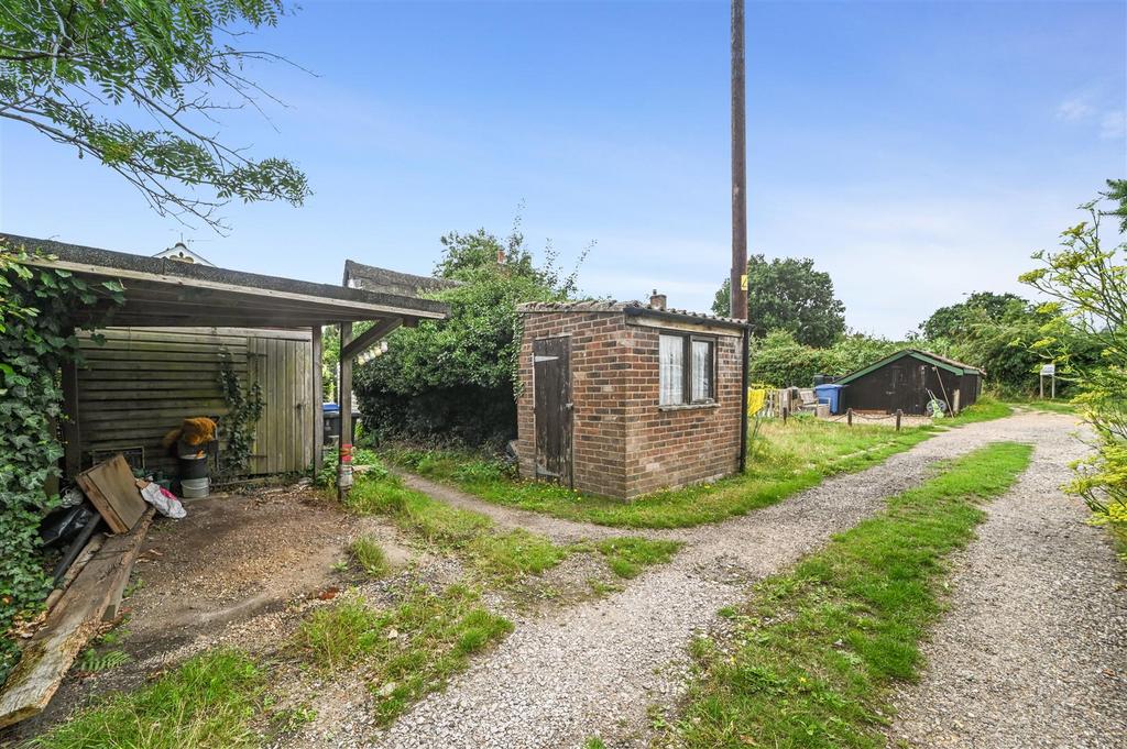 Parking space and storage shed