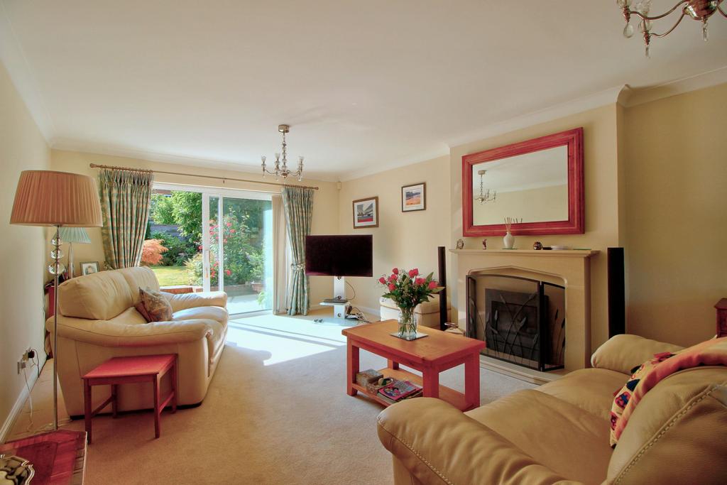 Living room with patio doors and bay window