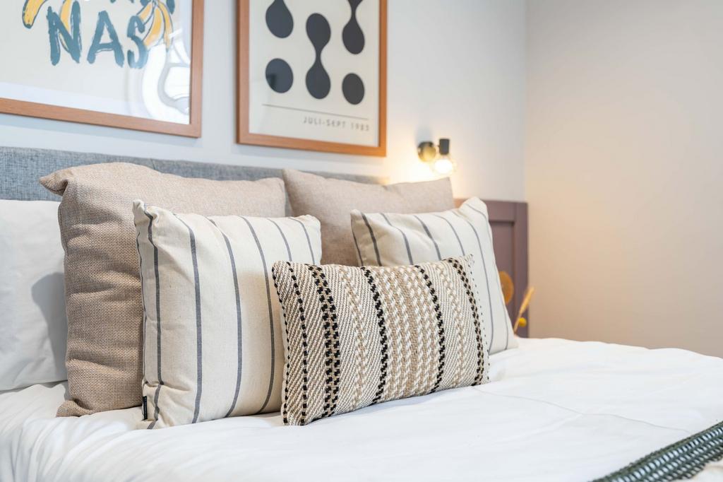 A spacious and inviting bedroom featuring a nea...