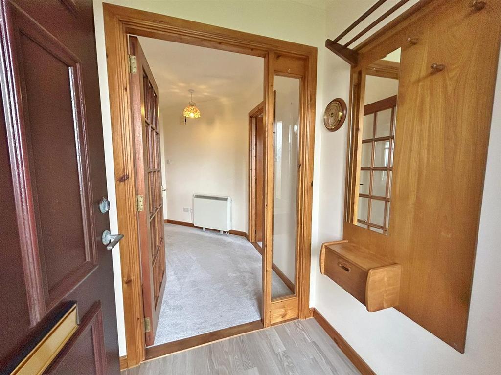 Front entrance vestibule to hallway