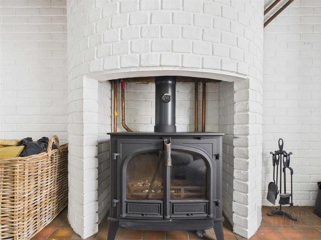 Wrought-iron log-burning stove