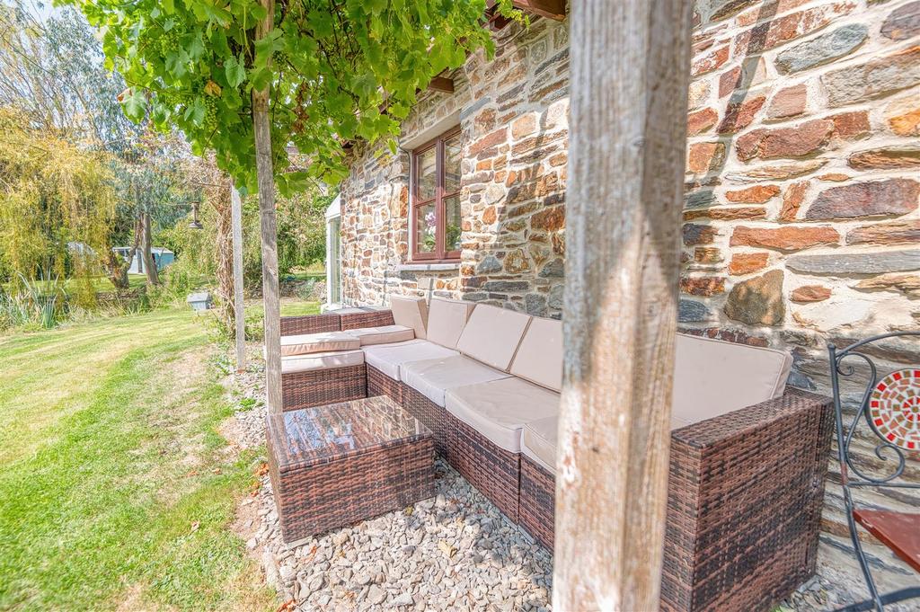 Outside seating under the grape vine