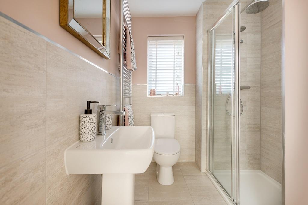 Bedroom two's en suite is ideal for guests or...