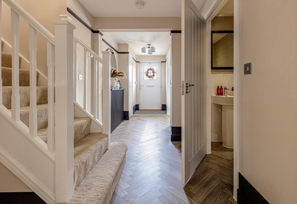 The entrance hall is welcoming with a...