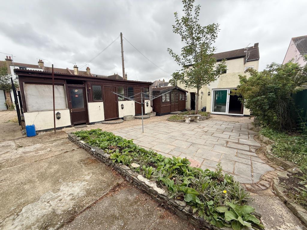 Rear garden with outside storage and side access