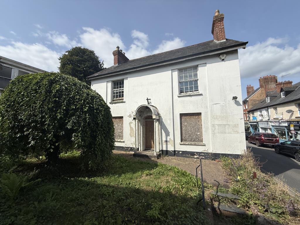 Main photo of the front of the property