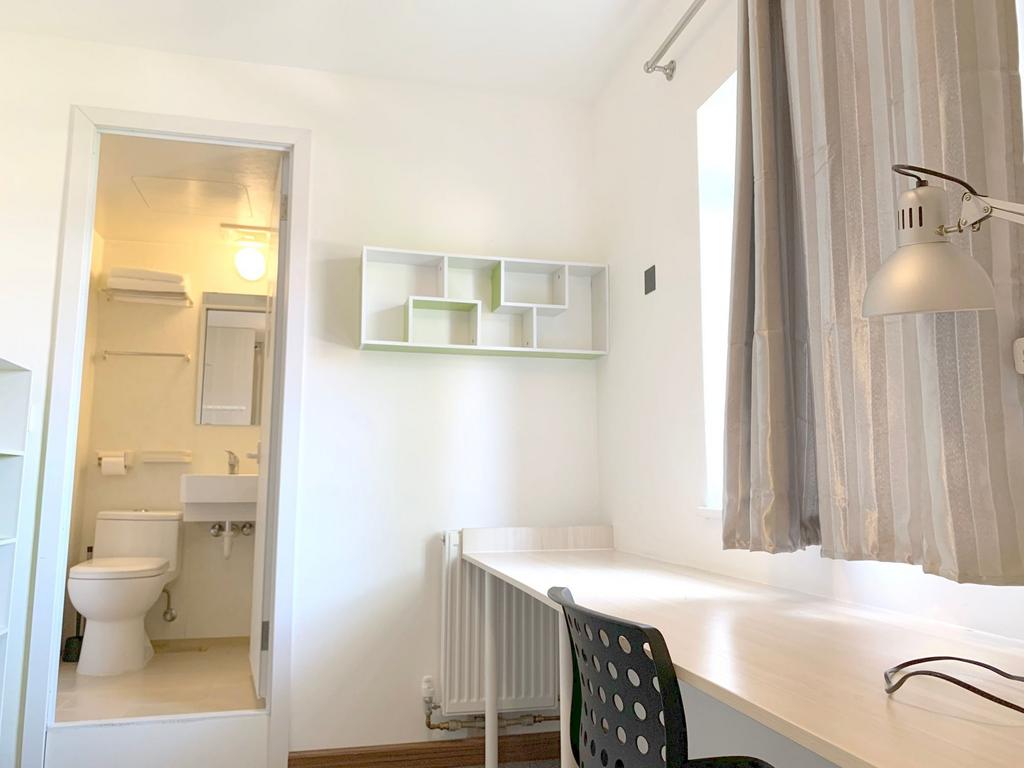 A bright and clean small bathroom area featurin...