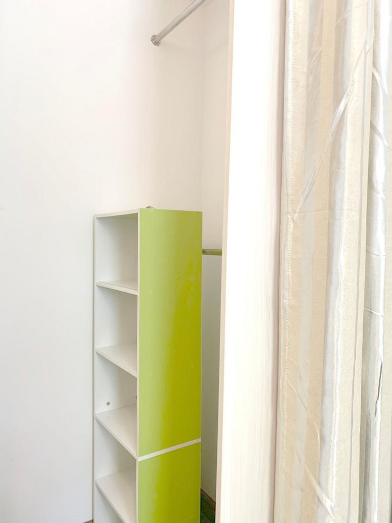 Bright and tidy storage area featuring a modern...