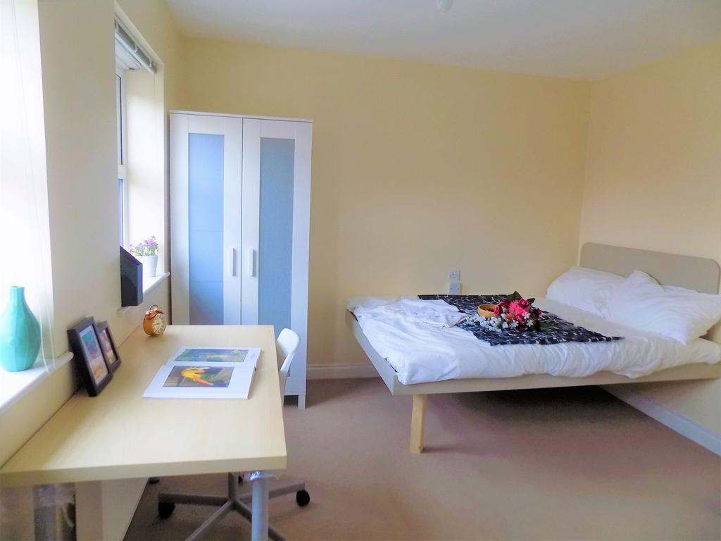 Bright and inviting double bedroom featuring a ...