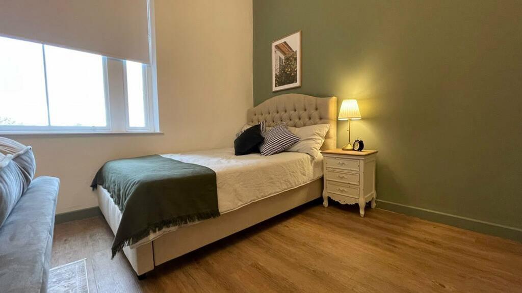 A beautifully decorated double bedroom featurin...