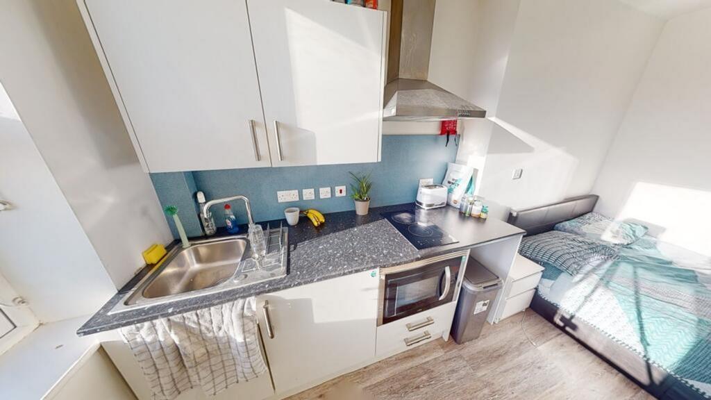 Stylish kitchenette with modern appliances, amp...