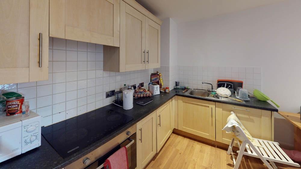 A compact, well-maintained kitchen featuring li...