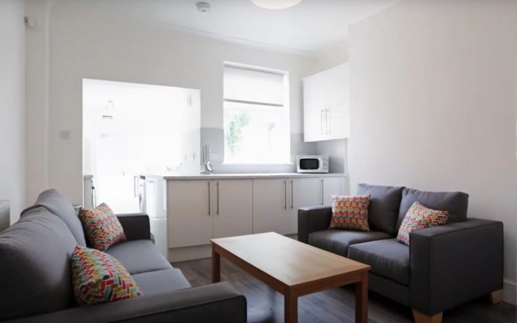 Bright and inviting living room featuring two c...
