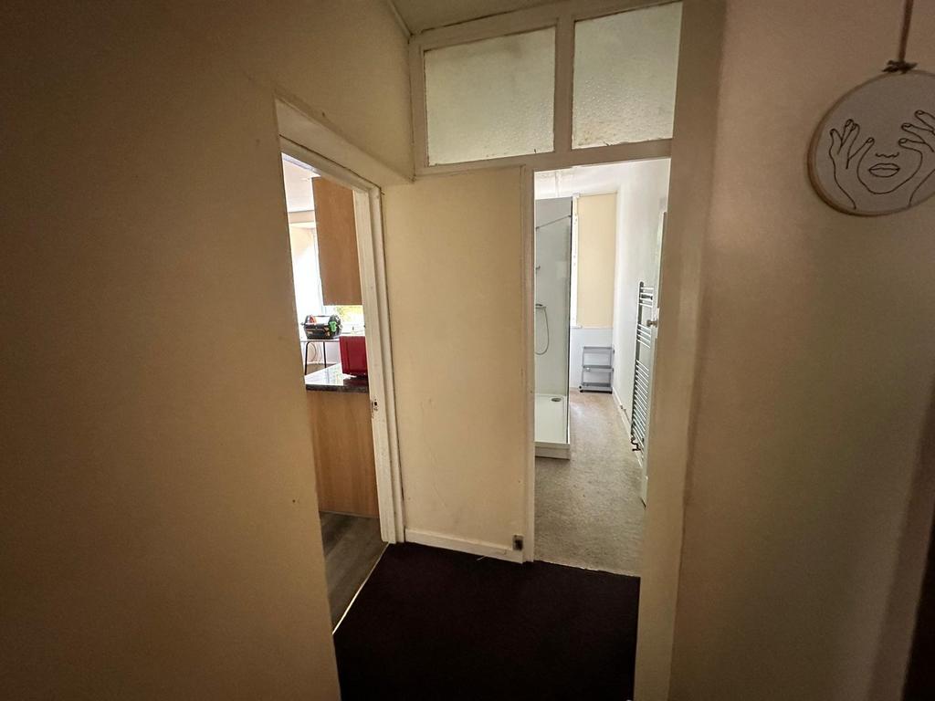 A functional hallway leading to various areas o...
