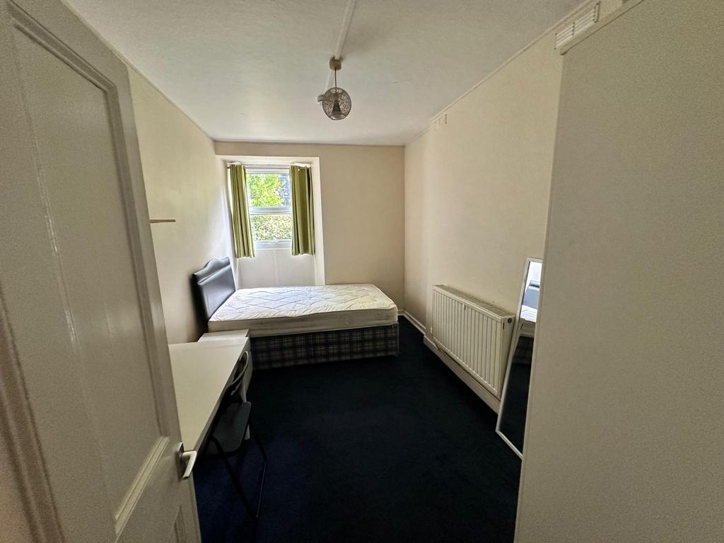 A well-lit and spacious double bedroom, perfect...